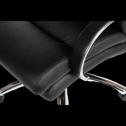 Close-up of a black office chair with chrome accents on a black background