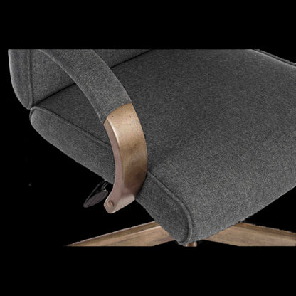 Gray upholstered chair with wooden armrest on a black background