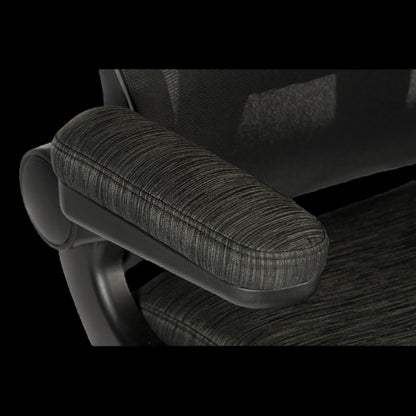 Close-up of a textured armrest on an office chair with a black background