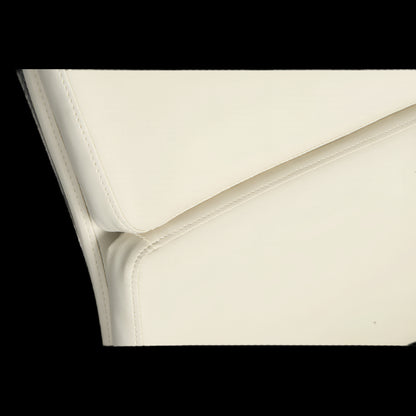 Close-up of a white leather surface with a subtle pattern