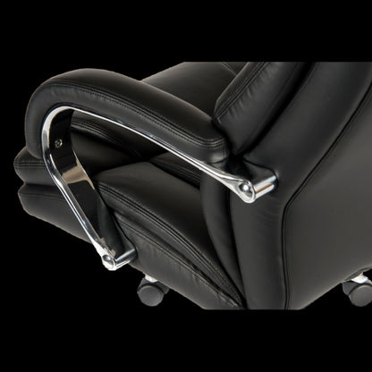 Close-up of a black office chair with a metallic armrest on a black background