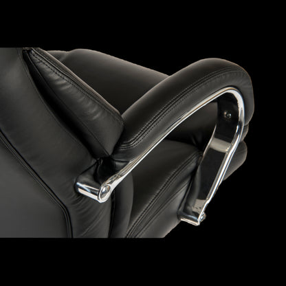 Close-up of a black leather office chair with chrome armrests on a black background