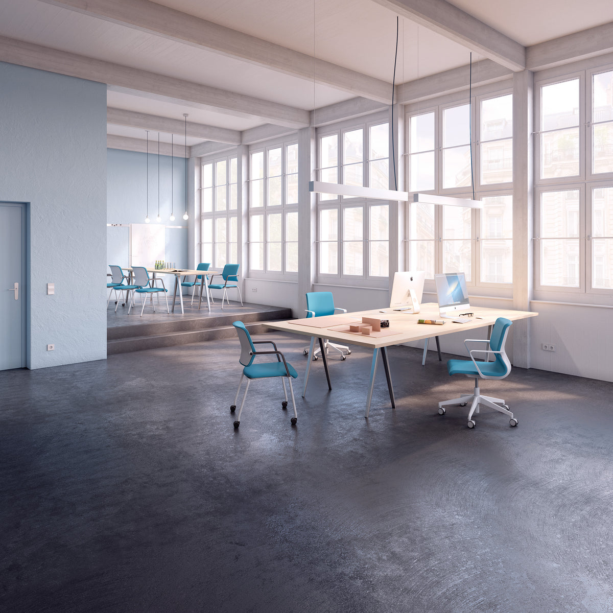 Drumback Task Chair around a shared table in a bright high-ceilinged office