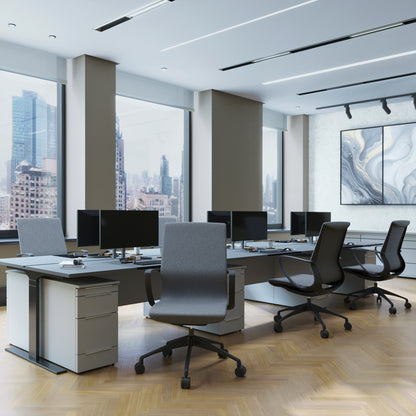 Modern office space with desks, chairs, and large windows overlooking a cityscape.