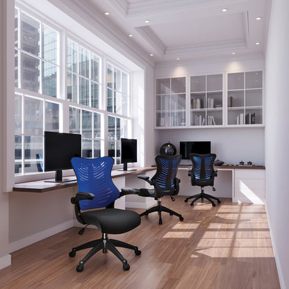 Modern office with desks, chairs, and large windows.