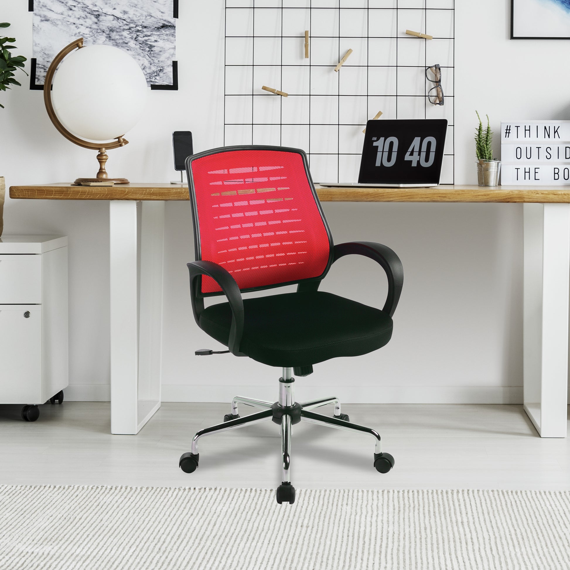 Red office chair in a modern office setting with a desk and decor.