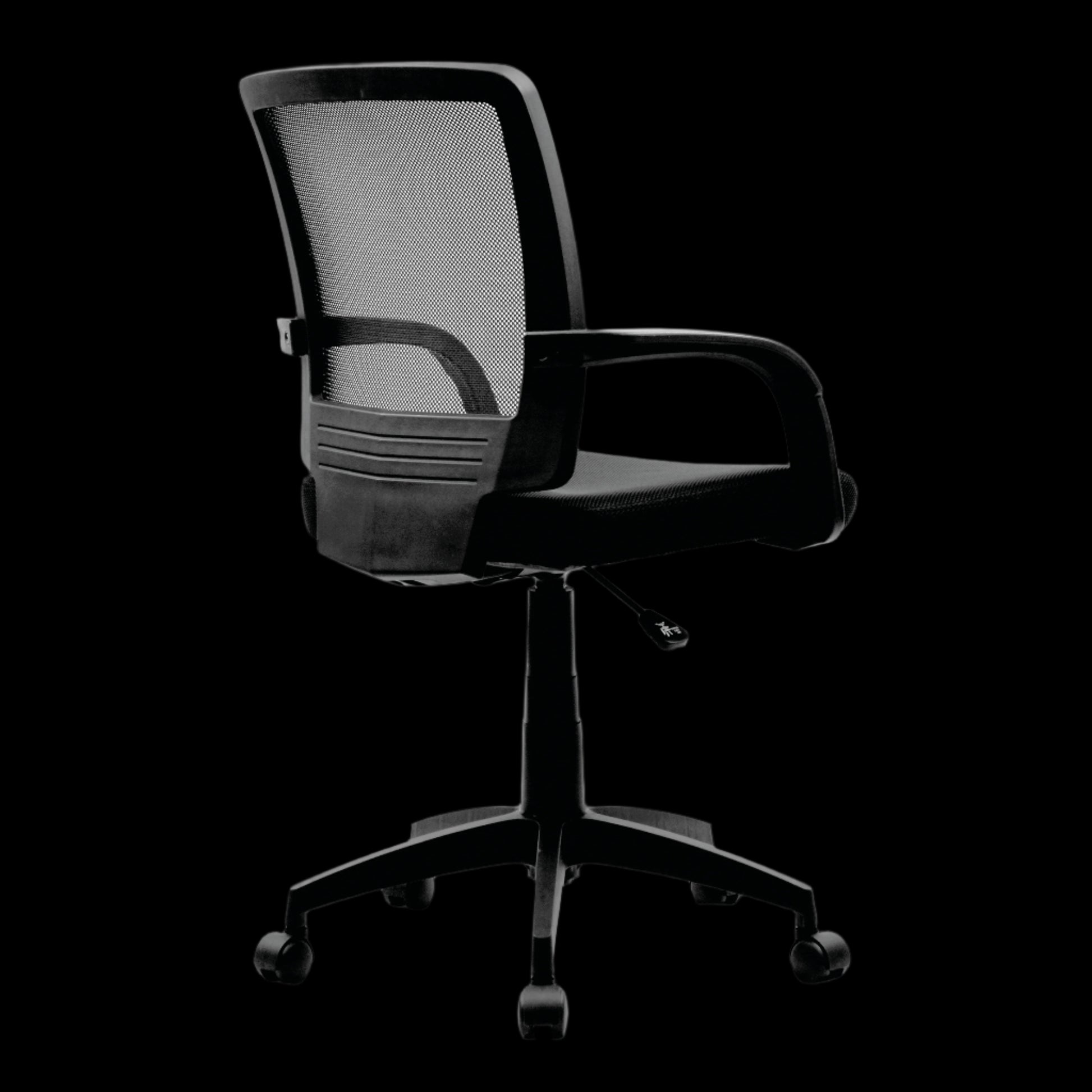 Black office chair with mesh back on a black background