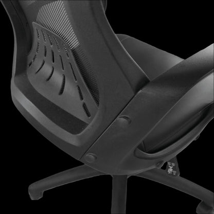 Black office chair with mesh backrest on a black background
