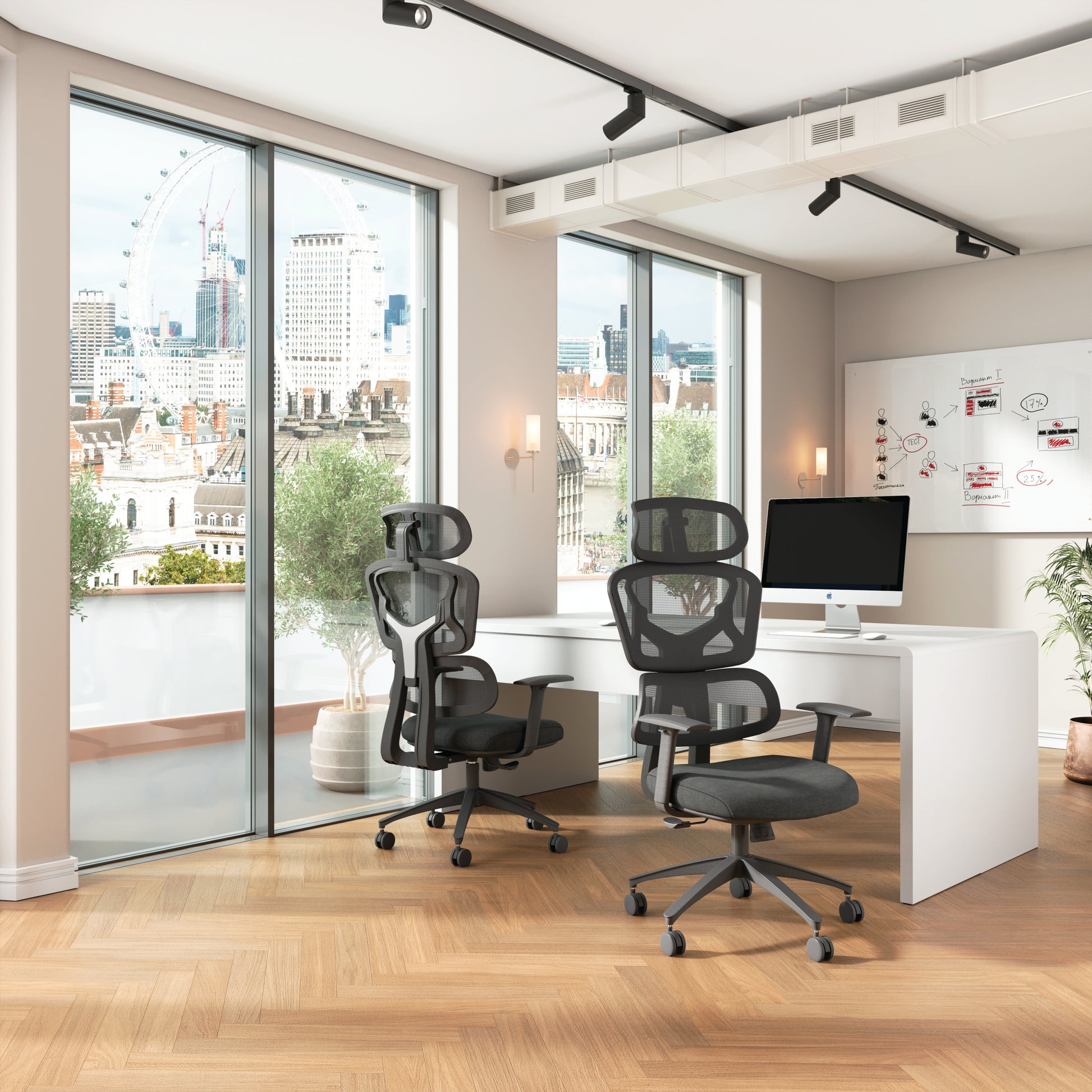 Modern office space with ergonomic chairs, a desk, and city view.