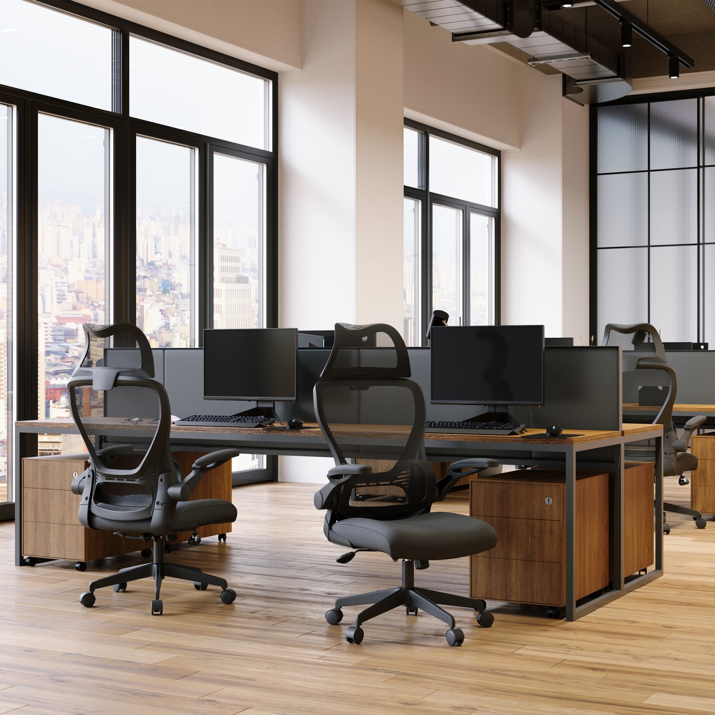 Modern office with desks, chairs, and large windows overlooking a cityscape.