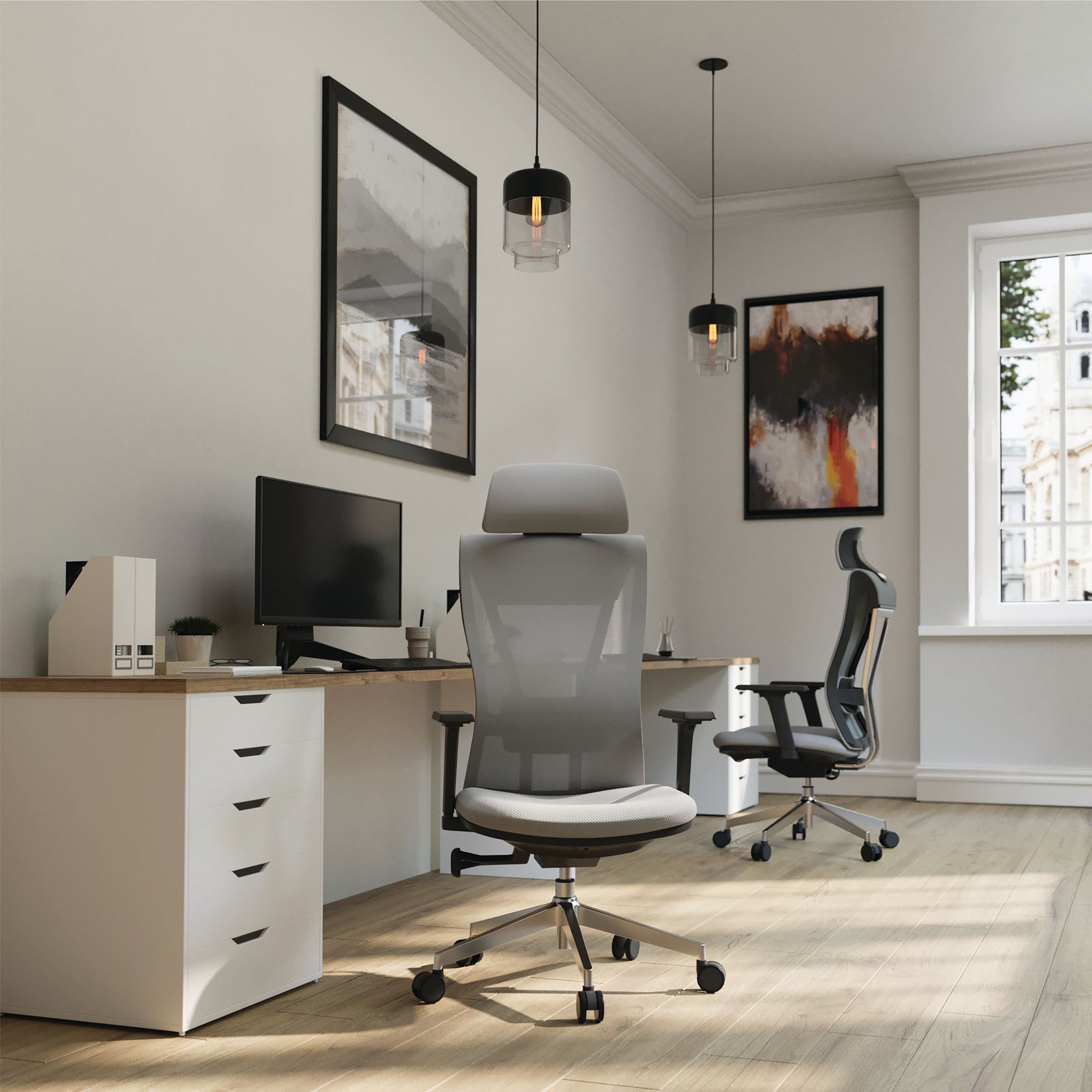 Modern office setup with ergonomic chairs, desk, and decor.