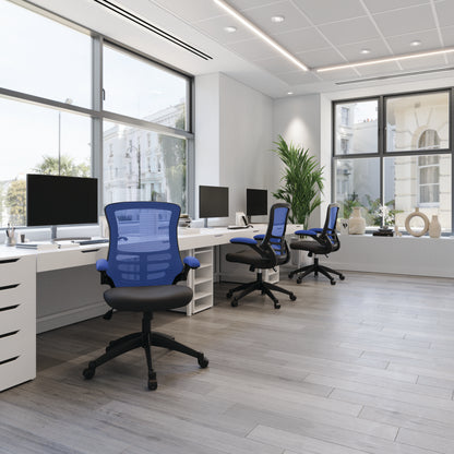 Modern office with desks, chairs, and large windows