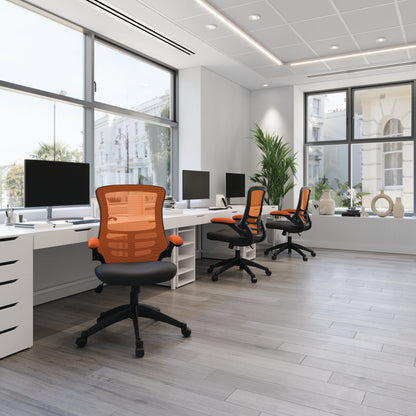 Modern office with desks, chairs, and large windows