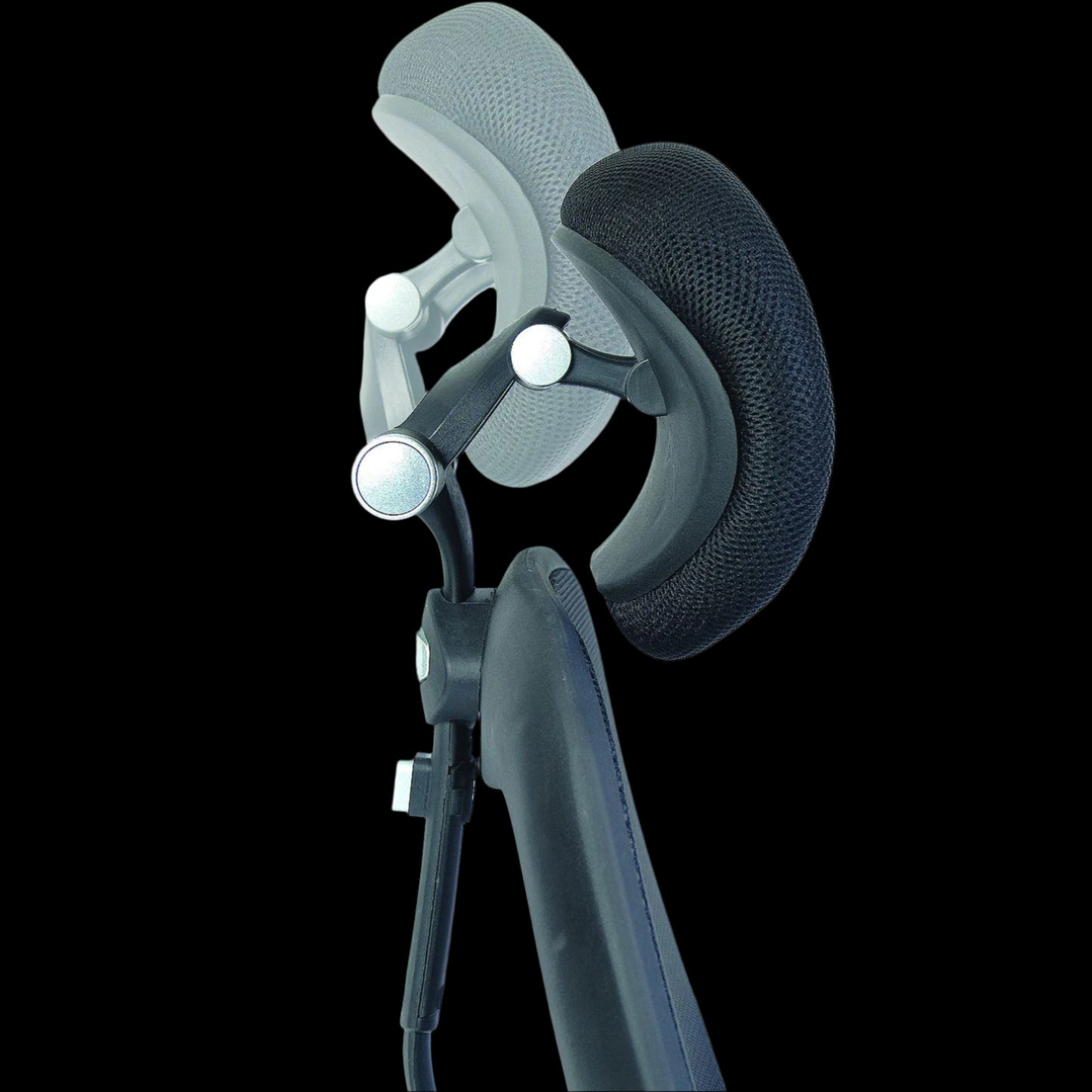 Close up of a black office chairs head rest on a black background
