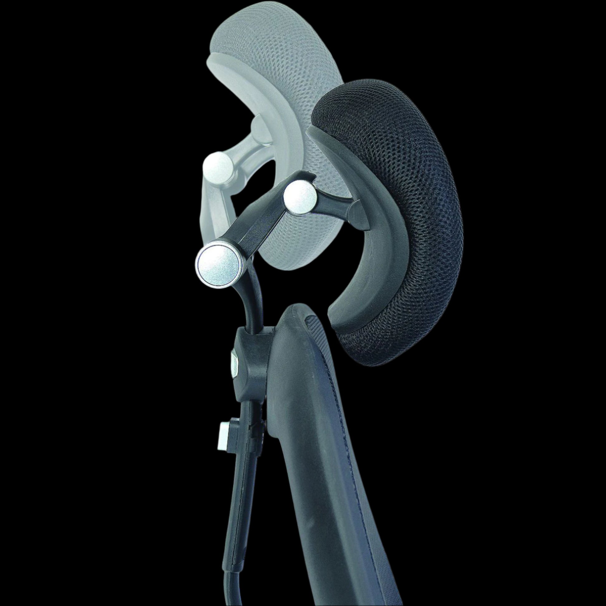 Close up of a black office chairs head rest on a black background
