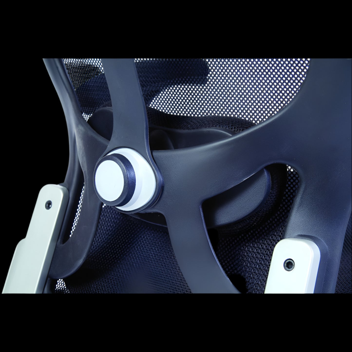 Close-up of a modern office chair with mesh backrest and dark frame.