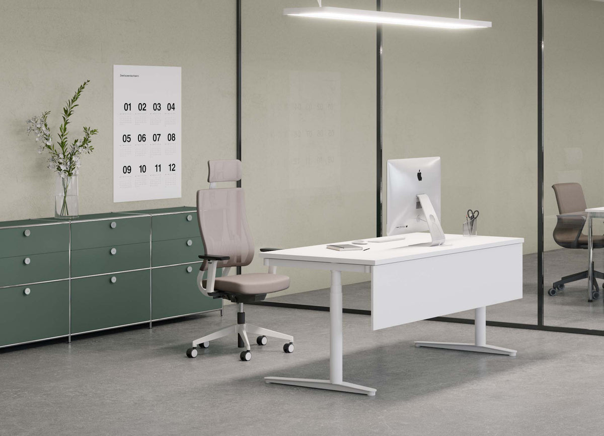 Newback Mesh Task Chair with headrest at a height-adjustable desk in a calm neutral office