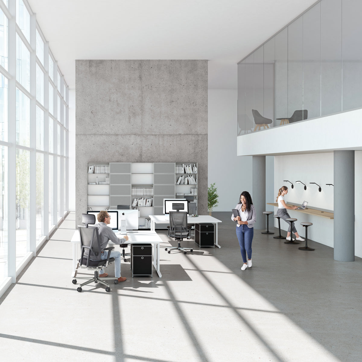 Scope Executive Chair at height-adjustable desks in a bright double-height office